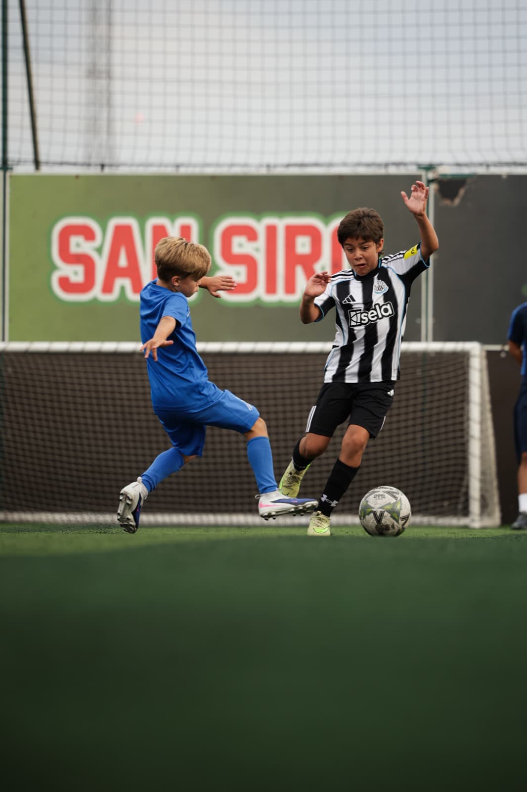 Two players contesting the ball in a match