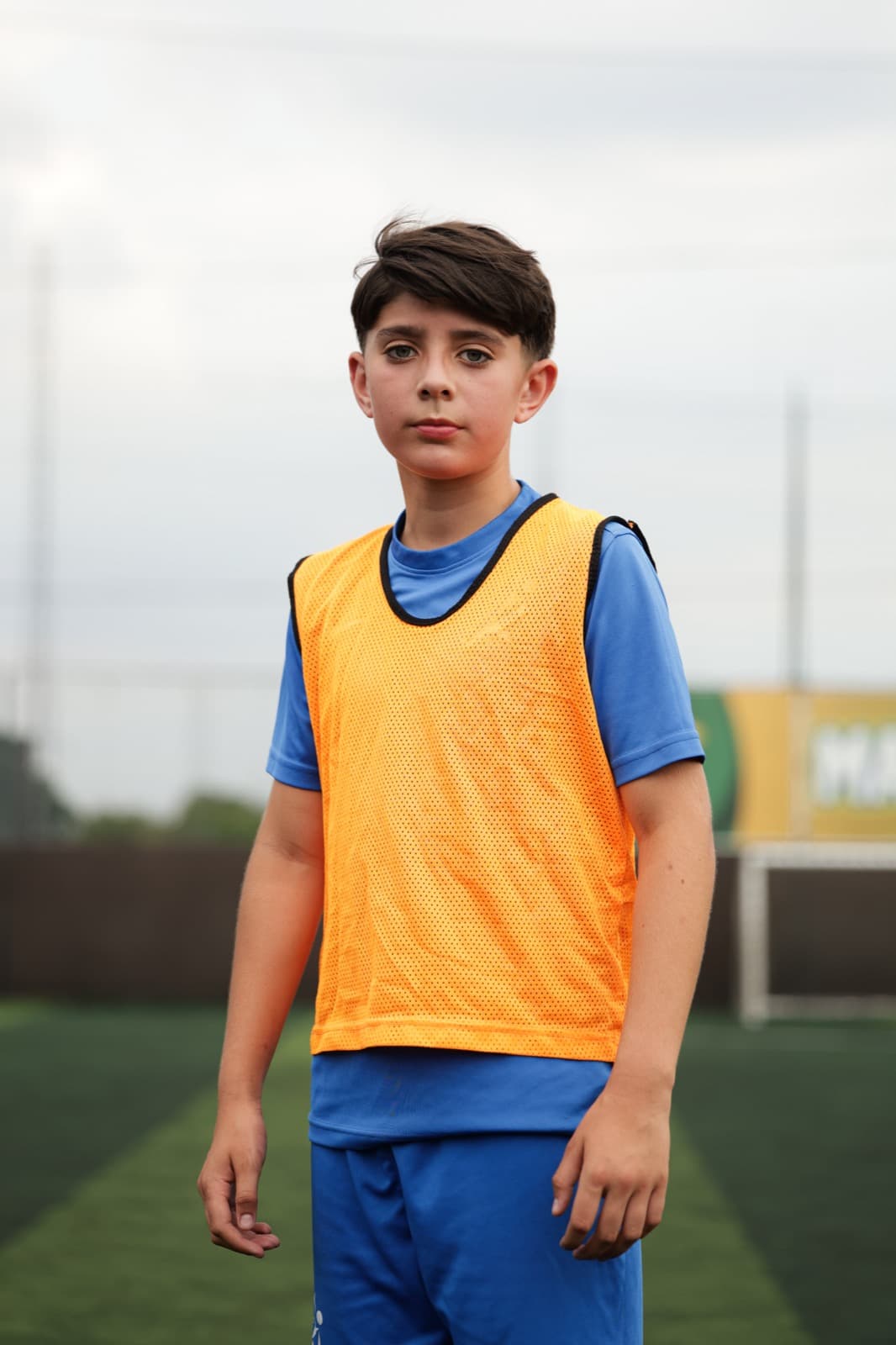 Young player in a training bib