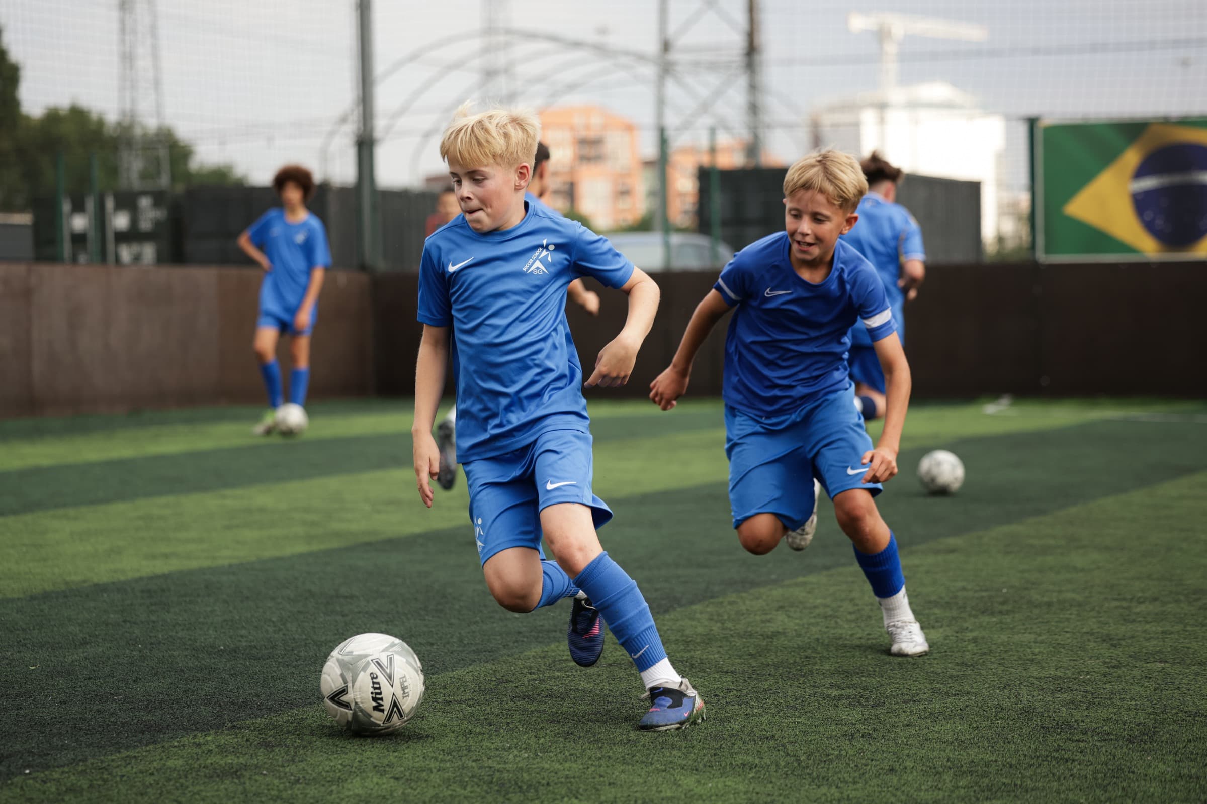SG Sport players chasing the ball in a match